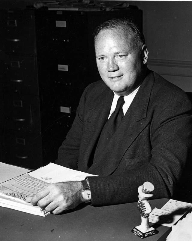 Hugh Fulton sits at a desk | Harry S. Truman