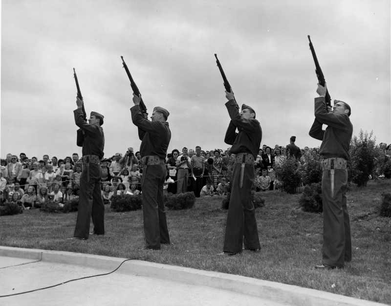 Four military men firing salute in Omaha, Nebraska during visit of ...