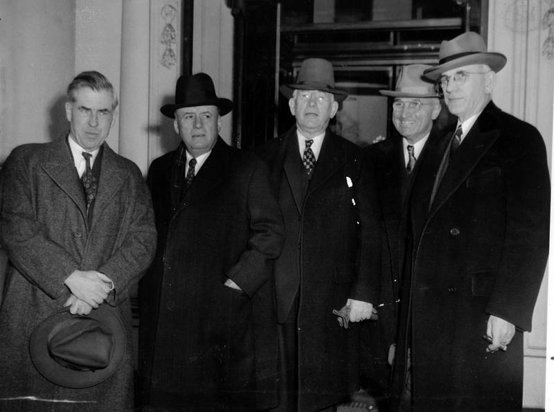 Truman and others leaving the White House after a meeting with ...