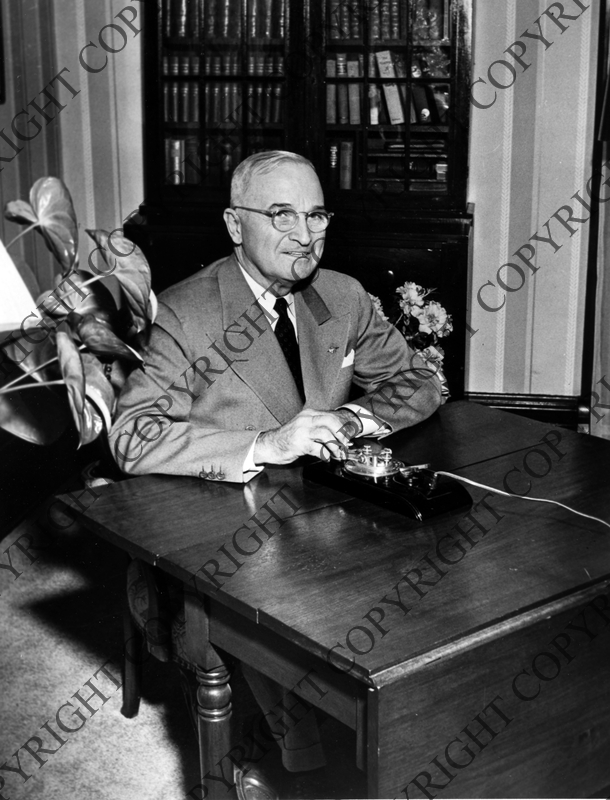 President Truman seated at a dining room table in his home in ...
